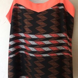 Coral and black camisole blouse.